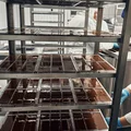 Шоколадную массу разлили по формам и везут в холодильник